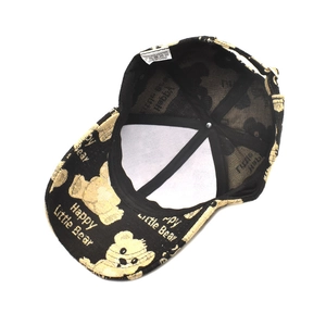 Internal view of black baseball cap with embroidered bear and 100% polyester wash label