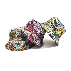 Detail showing graffiti letter print on reversible bucket hats with street style badges