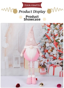 Detail of pink sequin gnome with long legs and white heart pattern for holiday decor