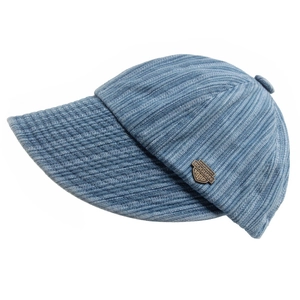 Detail of blue denim baseball cap with vintage metal badge and twill fabric texture
