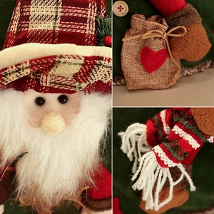 Christmas Santa doll with red plaid hat, white beard, and striped scarf decor