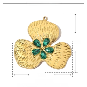 Detail of gold clover pendant with green teardrop stones and dimensions 31mm by 30mm