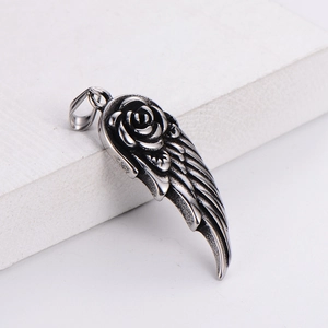 Gothic style silver feather wings pendant with carved rose flower in vintage metal finish