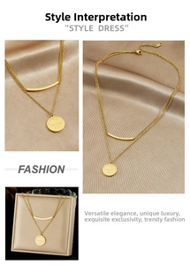 Detail of double-layer gold plated stainless steel necklace with engraved New York 520 disc