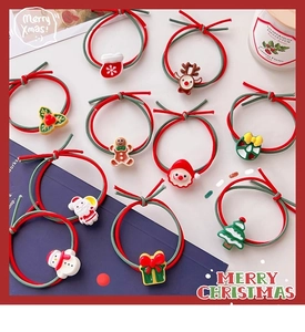Close-up of 10-piece Christmas hair ties featuring cute Santa, elk and tree resin charms