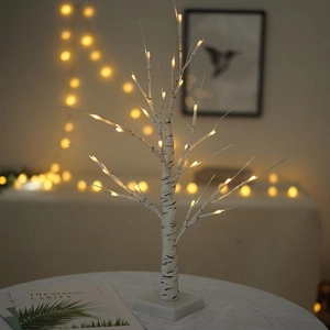Warm white LED birch tree lamp with realistic bark texture on a square white base