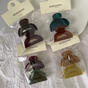 Set of eight solid color jelly acrylic hair clips in rich retro tones for styling hair