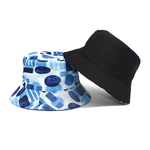 Fashionable unisex bucket hats with blue artistic geometric print and classic black cotton design