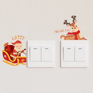 Glow-in-the-dark Christmas Santa and Reindeer decals on light switch wall plate