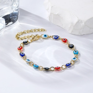 Detail of bohemian evil eye bracelet with colorful beads and gold adjustable chain link