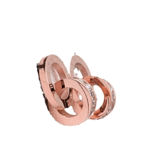 Rose gold interlocking double ring earrings with Roman numerals and cubic zirconia