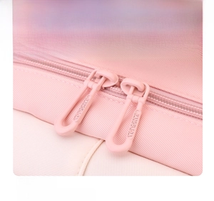 Close-up of a smooth two-way zipper design on a pink nylon school backpack