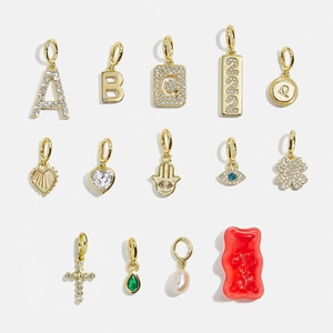 Golden 18K plated stainless steel birthstone charms with zircon and pearl accents