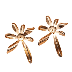 Polished gold metallic double-layered floral earrings set with irregular petals on white background