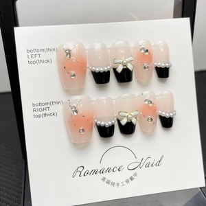 Handmade gradient pink and black French bow press-on nails with pearls and rhinestones