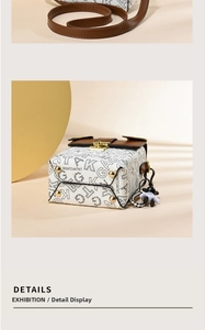 Detail of a rabbit crossbody bag featuring a printed logo, gold lock, and cute sheep charm