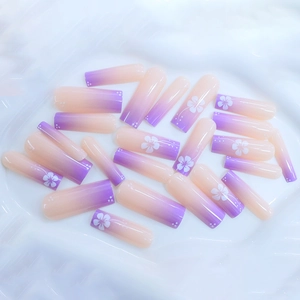 Classic purple gradient press-on nails with white flower patterns in long coffin shape