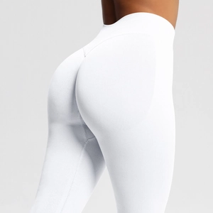 Detailed view of high-waist seamless white yoga pants with peach butt lifting stitching
