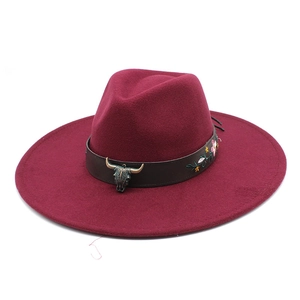 Ethnic wide brim fedora in wine red with a leather band and bull head ornament