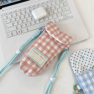 Quilted pink checkered phone bag with adjustable strap and heart stitching detail