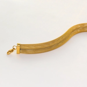 Detailed close-up of gold mesh woven necklace texture with lobster clasp closure