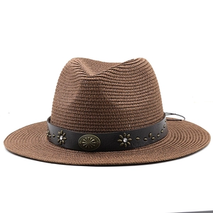 Brown wide brim straw fedora with leather band and metal floral rivet details
