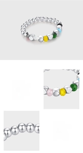 Macro detail of s925 sterling silver colorful beaded ring with multi-color faceted stones
