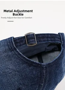 Close-up of denim baseball cap showing metal adjustment buckle and twill fabric texture