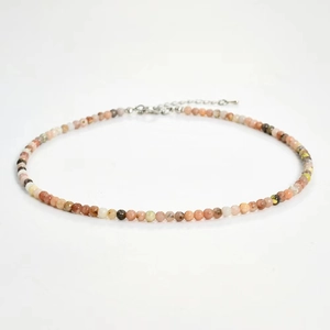Detailed close-up of handmade 4mm colorful natural stone beaded necklace with metal clasp