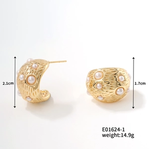 Detail view of gold textured earrings with white pearl inlay and exact dimensions