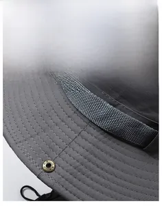 Macro detail of tear-resistant dark grey fabric with reinforced stitching on sun hat