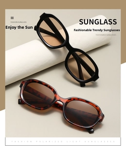 Detail of polarized oval sunglasses with tortoise frames and product spec codes