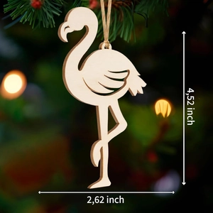 Detail of wooden flamingo ornament showing dimensions 4.52 by 2.62 inches with hanging cord