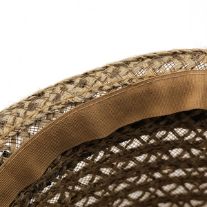 Close-up of the breathable linen fedora featuring detailed woven texture and brown sweatband