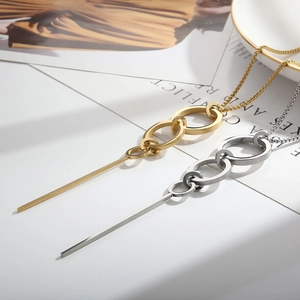 Long geometric hollow circle pendant sweater necklace in gold and silver steel finish