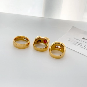 Detailed view of 18K gold plated steel ring set featuring heart and square zircon stones