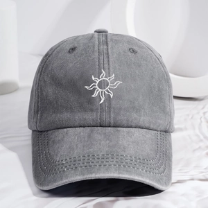 Vintage dark gray washed cotton baseball cap with white sunflower embroidery and curved brim