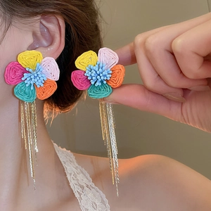Colorful woven flower earrings with long gold tassels, elegant bohemian style for vacation