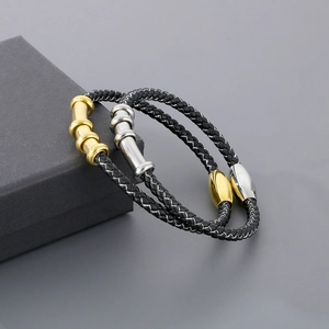 Braided leather bracelets with stainless steel magnetic clasps in black, gold, and silver