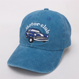 Detail of vintage car embroidery and corduroy texture on blue kids baseball cap