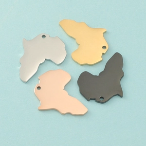 Detail view of African map pendants in gold silver rose gold and black finishes