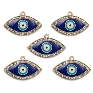 Macro shot of five blue evil eye charms with gold plating and white rhinestones