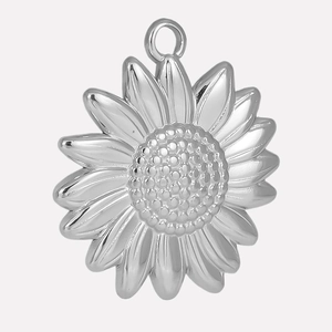 Detailed macro of a polished stainless steel sun pendant for DIY jewelry making