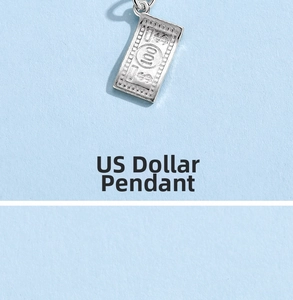 Macro detail of a 925 silver 100 US dollar bill pendant with fine engraved textures