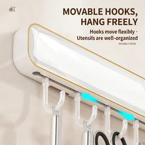 Wall-mounted kitchen knife rack with movable hooks and gold trim in white ABS material