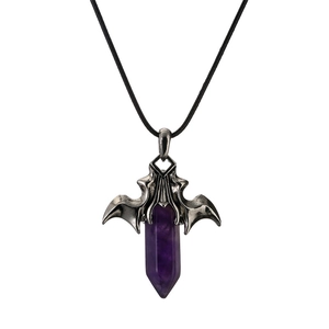 Detailed view of gothic bat wings pendant with purple hexagonal crystal on black cord
