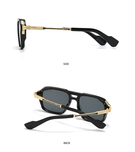 Detail view of black square aviator sunglasses with gold temples and vintage textures