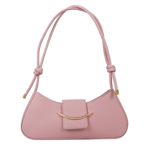 Pink leather underarm shoulder bag with golden curved metal buckle and knotted strap
