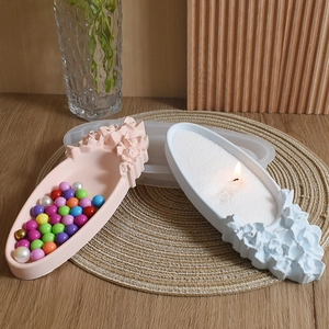 Macro view of embossed floral oval tray silicone mold with finished resin craft tray