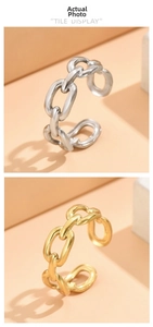Detail view of adjustable chain link rings in polished gold and silver finishes
